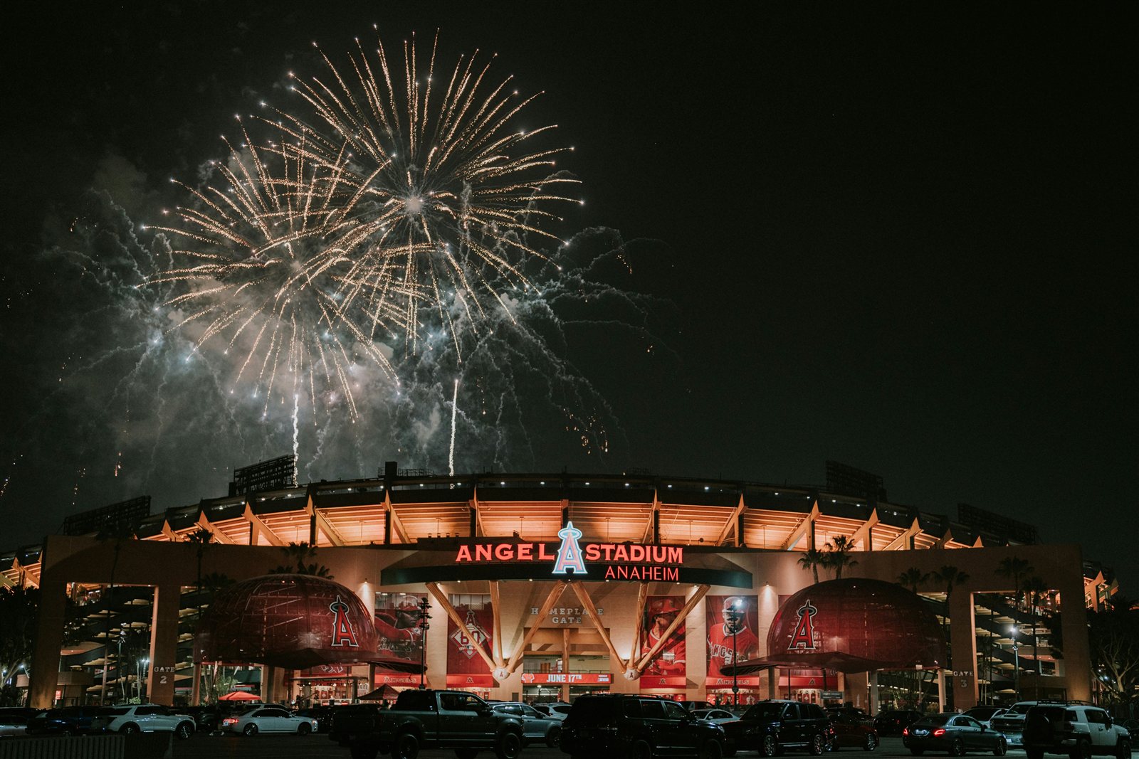 Angel Stadium of Anaheim lit up at night with fireworks